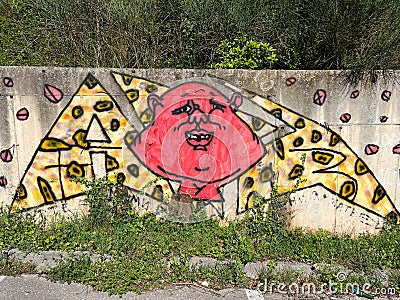 Colored graffiti on a concrete wall. Humorist U Editorial Stock Photo