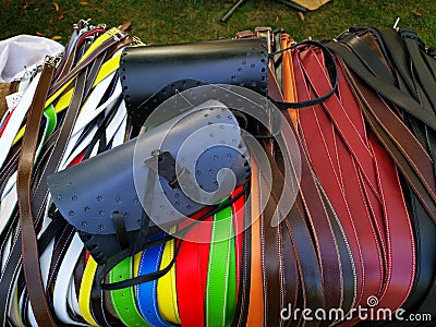 Colored leather belts and shoulder bags Stock Photo