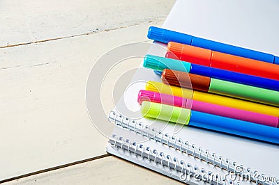 Colored markers and album Stock Photo