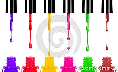 Colored nail polishes dripping from brush into bottle Stock Photo