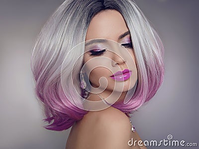 Colored Ombre hair extensions. Beauty Model Girl blonde with short bob purple hairstyle isolated on gray background. Closeup Stock Photo