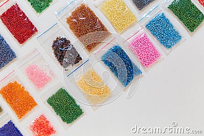 Colored packed beads laid out in a diagonal shape with space for text down Stock Photo