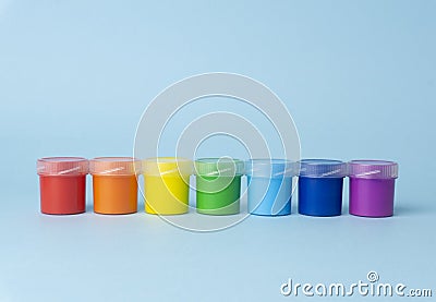Colored paints for drawing in the sequence of colors of the rainbow. Bright color paints for drawing Stock Photo