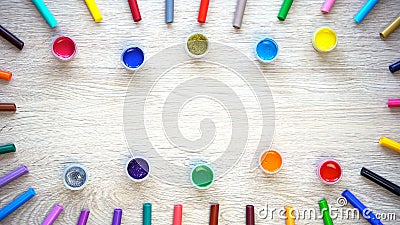 Colored paints and felt-tip pens lying on table, design and graphics courses Stock Photo