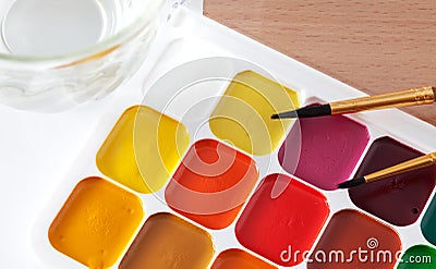 Colored paints on the table Stock Photo