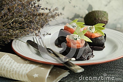 Colored pancakes. black pancakes with cuttlefish ink Black food. Pancake week. Stock Photo