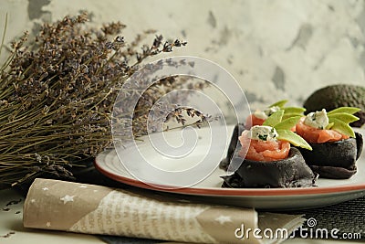 Colored pancakes. black pancakes with cuttlefish ink Black food. Pancake week. Stock Photo