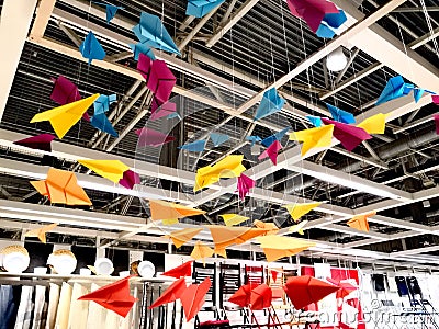 Colored paper airplanes on strings Editorial Stock Photo