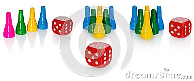 Colored pawns and red dice. Set pieces in the colors yellow, green, blue. Cube in red with white eyes. Stock Photo