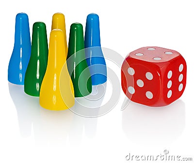 Colored pawns and red dice. Set pieces in the colors yellow, green, blue. Cube in red with white eyes. Stock Photo