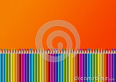 Colored pencil group isolated on orange. Horizontal background Stock Photo