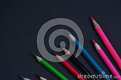 Ð¡olored pencils on a wooden table. Stock Photo