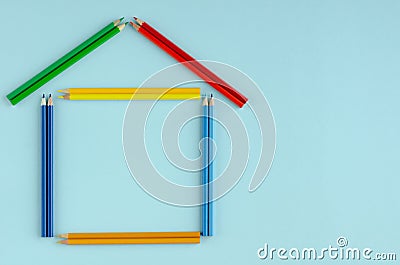 Colored pencils composition on blue background. Flat lay Stock Photo