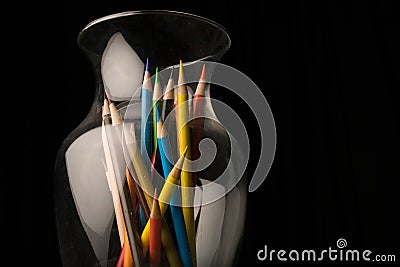 Colored pencils in a glass vase Stock Photo