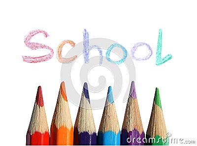 Colored pencils and the handwritten word School on white background Stock Photo