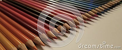 Colored pencils lined up Stock Photo