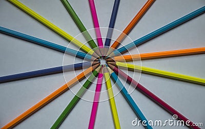 Colored pencils lined on a white sheet of paper Stock Photo