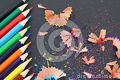 Colored pencils sharp sharpened lie on a table with rubbish Stock Photo