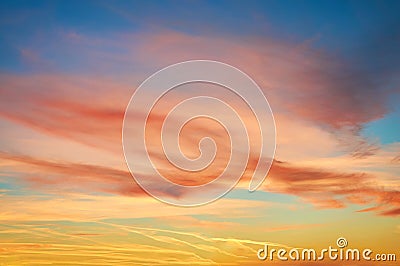 Colored porous clouds at sunset against blue sky. Dramatic sky. Stock Photo