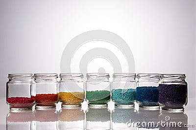 Colored rice for the development of fine motor skills Stock Photo