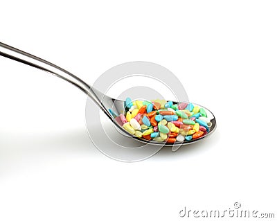 Colored rice on spoon Stock Photo