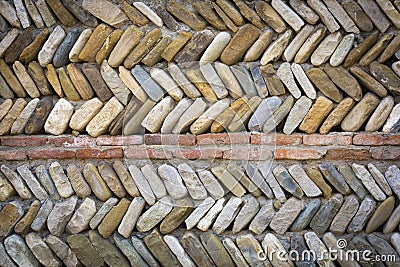 colored river pebbles round stone wall background close up Stock Photo