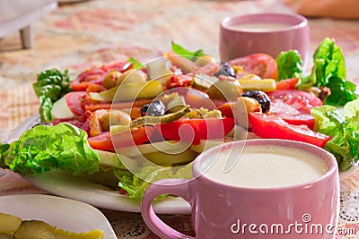 Colored salad and french fries with Pickled Cucumber and cups Stock Photo