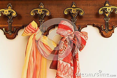 Colored scarves on antique hanger Stock Photo