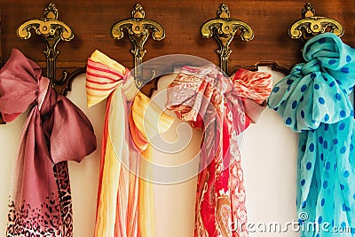 Colored scarves on antique hanger Stock Photo