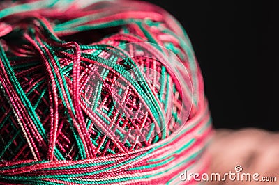 Colored skeins of yarn lit by the sun Stock Photo