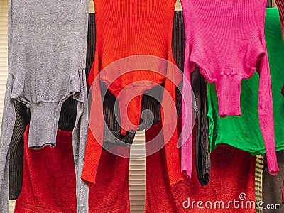 Colored textile laundry. Colored vibrant colors purple, red and gray. Stock Photo