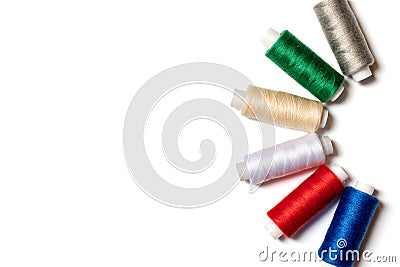 Colored thread coils on white background, sewing, handmade and DIY concept - layout for hobby and DIY such as dressmaking Stock Photo