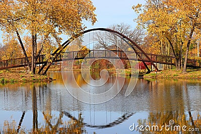 Beautiful fall landscape with a bridge in the city park. Stock Photo