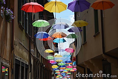 Colored umbrellas flying to other planets Editorial Stock Photo