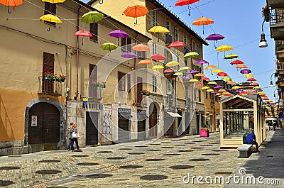 Colored umbrellas, hanging between the houses along the alleys Editorial Stock Photo