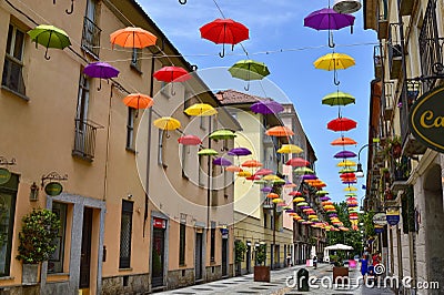 Colored umbrellas, hanging between the houses along the alleys Editorial Stock Photo