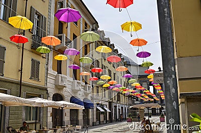 Colored umbrellas, hanging between the houses along the alleys Editorial Stock Photo