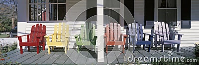 Colored Wooden Chairs on porch Stock Photo
