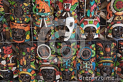 Colored wooden masks at a souvenir stand in Chichen Itza, Yucatan, Mexico Stock Photo