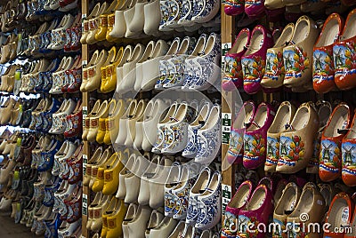 Colored wooden shoes, a traditional souvenir from Holland, hanging on the wall. Editorial Stock Photo