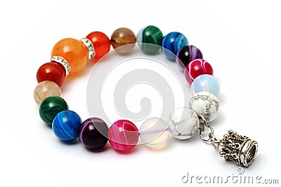 Colorful of agate,jasper bracelet decoratAe with silver crown pendant Stock Photo