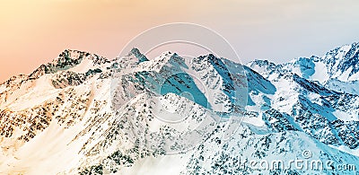 Colorful Alpine panorama. Snow-capped mountain peaks Stock Photo