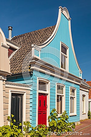 Colorful ancient blue wooden house in The Netherlands Stock Photo