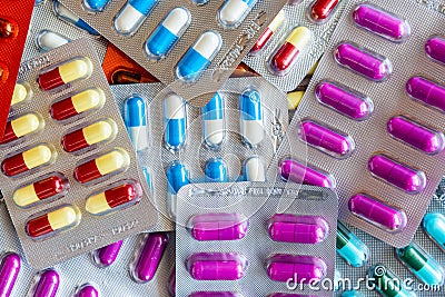 Colorful antibiotic drug capsule pills in blister package Stock Photo