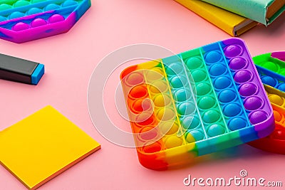 Colorful antistress pop it toy on pink background Stock Photo