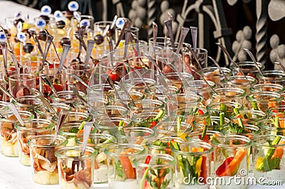 Colorful appetizers in small glasses in rows Stock Photo