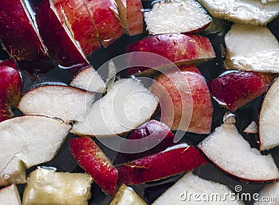 Colorful Apple Slices, Mixed Fruits In A Pot. Refreshing Fruit Apple Cider Punch Party Drink. Organic Food And Beverage Stock Photo