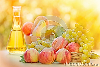 Colorful apples, white grapes and white wine Stock Photo