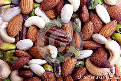 Colorful assorted nuts background - almonds, cashews, pistachios, white almonds texture Stock Photo