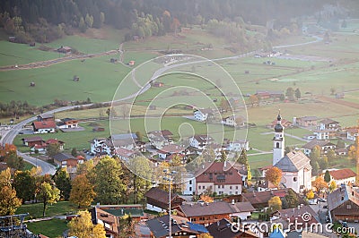 Colorful autumn scenery of Lermoos village lit up by golden sun light in the early morning Stock Photo